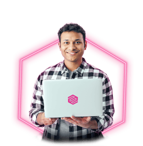 Ethisham-neon man smiling in front of laptop