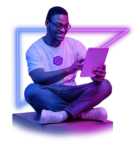 neon man sitting looking at tablet 2021-07